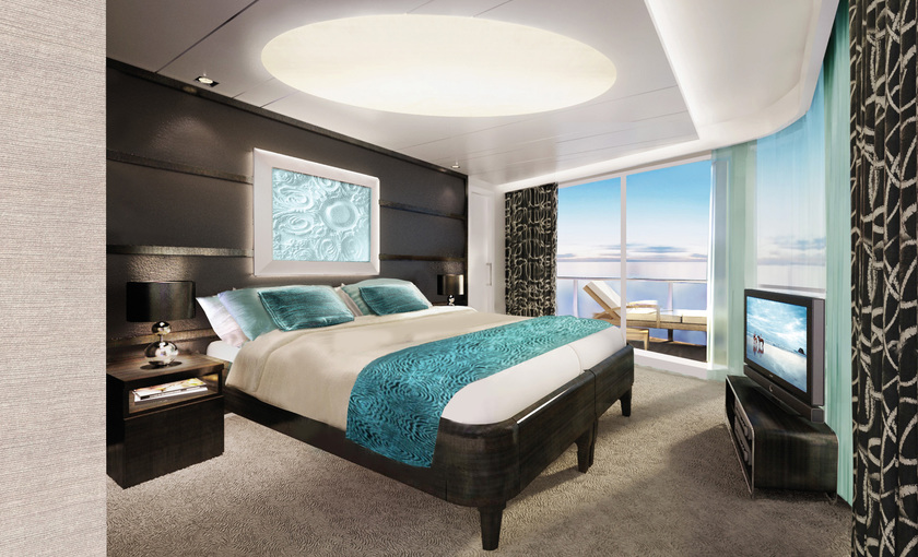 De slaapkamer van de Owner Suite op de Norwegian Breakaway van NCL